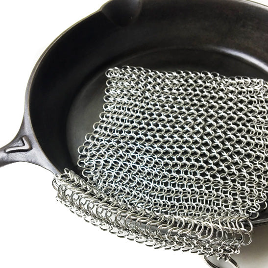 https://pricedrightsales.com/cdn/shop/products/crisbee-cast-iron-8x8-chain-mail-scrubber-in-pan.jpg?v=1658946900
